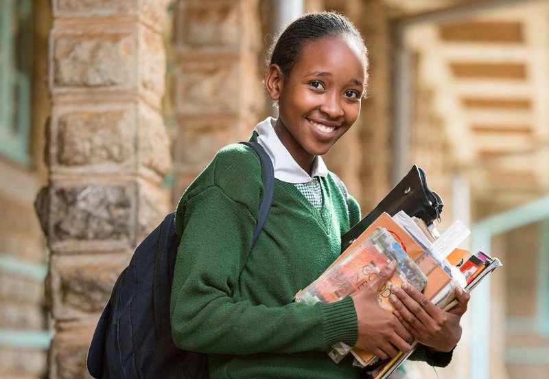 Student with school materials, Nyeri Primary School, Nyeri County, Kenya. Photo credit: GPE/Kelley Lynch